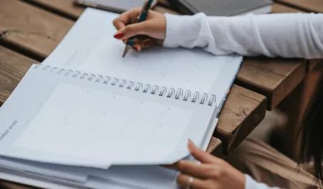 Person typing on a notebook